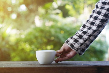 little girl holding tea cup.