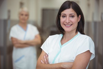 Fototapeta premium Portrait of female nurse standing in corridor