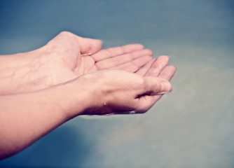 hands in water
