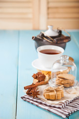 cookies with cinnamon and tea on a table, selective focus, copy space