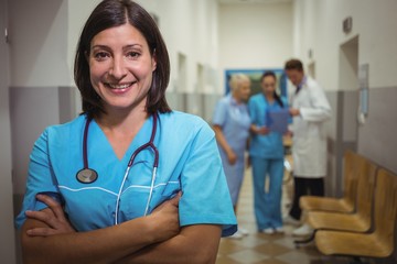 Portrait of female surgeon standing in corridor