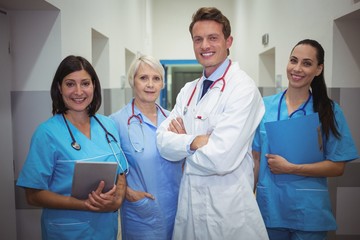 Team of doctors standing in corridor