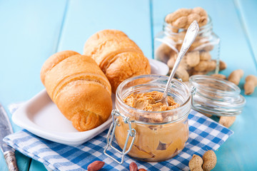 peanut paste and croissants on a table, selective focus