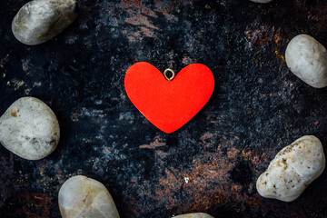 Obraz premium Red heart in circle of rocks