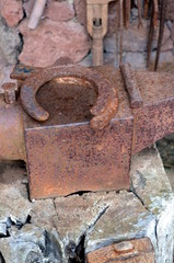Old blacksmith's anvil with horseshoe
