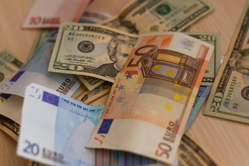 Cash on table isolated: dollars, euro broken money All in mess, global crisis concept