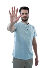 Naklejka premium Man pretending to touch an invisible screen