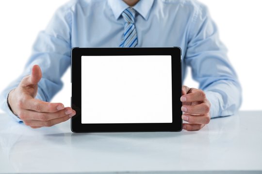 Businessman showing a digital tablet
