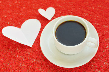 black coffee mug and card on a table