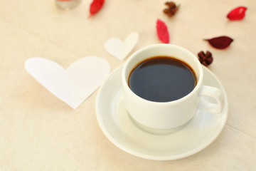 black coffee mug and card on a table