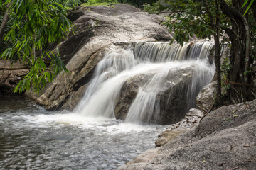 Nine dives waterfall falls from a cliff in the Central Valley Tenasserim mountain range located in Ratchaburi province Thailand. 
