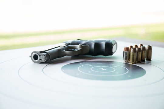 type of .45 bullets on  bullseye target with pistol