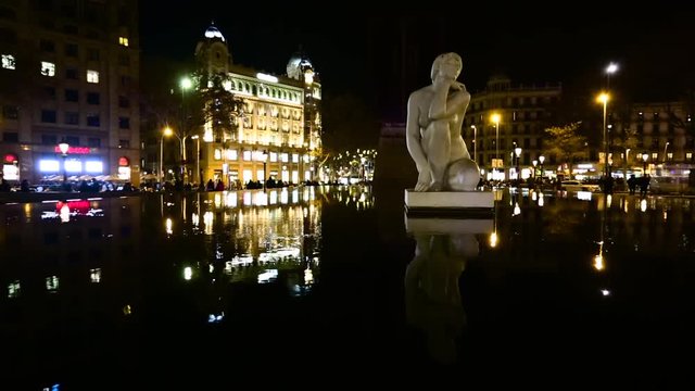 Night view of the fountain on Catalunya Plaza during the Christmas holidays in Barcelona, Spain