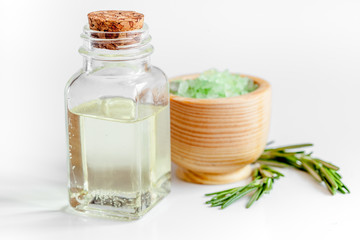 organic cosmetics with extracts of herbs rosemary on white background