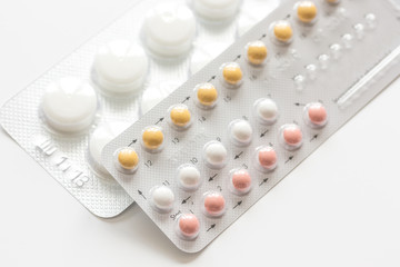 concept of female contraception on white background