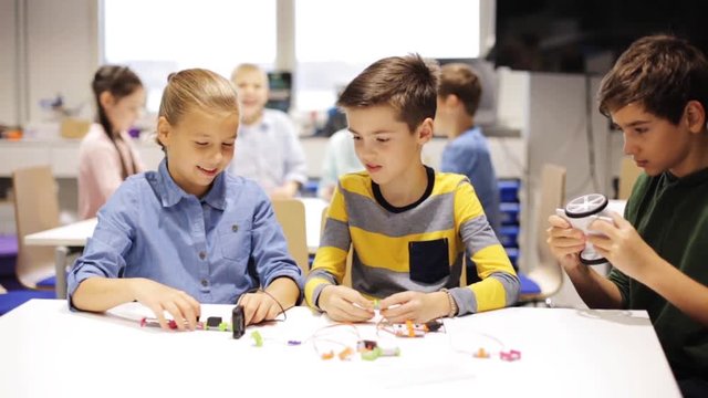 happy children learning at robotics school