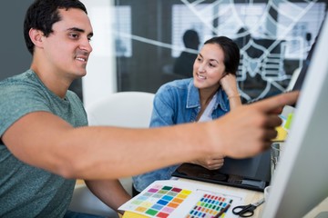 Graphic designers working at desk