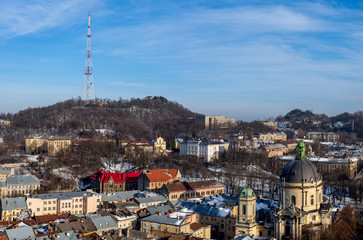 Winter panorama - landscape of old town with red roof