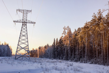 High voltage power lines in the winter. Winter landscape.