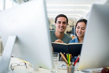 Graphic designers working at desk
