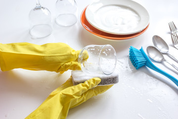 concept of woman washing dishes on white background