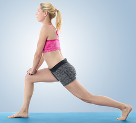 Fototapeta premium Woman making pilates mat exercises