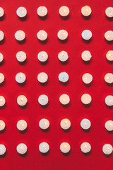 Flat lay fashion set of Christmas lighted candled in lines. Minimalism.