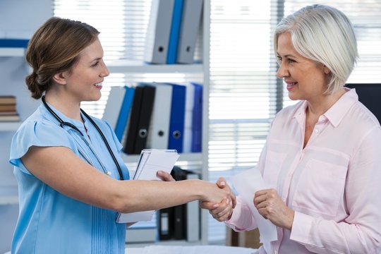 Doctor Shaking Hands With Patient