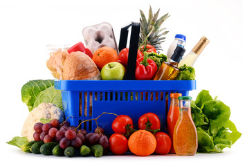 Plastic shopping basket with assorted grocery products