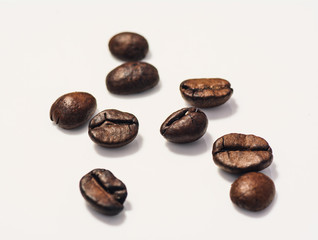 Roasted coffee beans isolated on white background with copy space. Frame for creative concepts or advertising