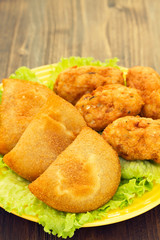 typical portuguese snack ricoes de carne and Bolinhos de bacalha