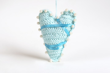 Heart knitted toys for Christmas tree, decorated with beads, lace and ribbons