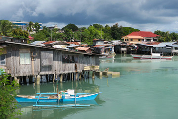 Fototapeta na wymiar Floating Fishing Village with Rustic boats and Houses - Tagbilaran, Bohol - Philippines