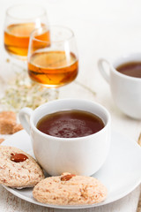 a cup of coffee with almond cookies