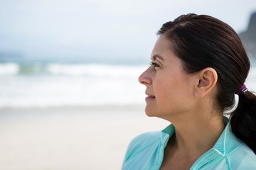 Close-up of thoughtful woman on beach