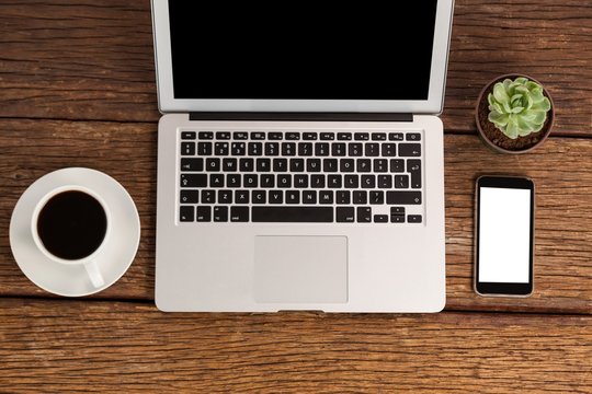 Laptop and smartphone with cup of coffee