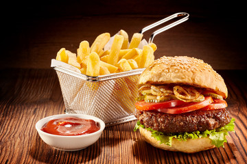 Burger with french fries and ketchup