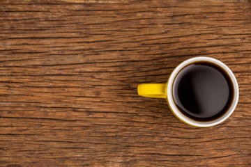Cup of coffee on wooden table