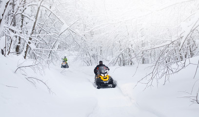 Winter Finnish snowy lanscape with road and snowmobile