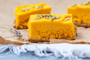 Slices of raw vegan pumpkin cheesecake. Love for a healthy raw desserts concept.