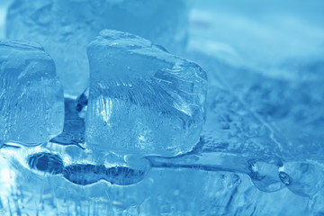 Frozen ice cubes gems. abstract blue crystal background. macro view soft focus photo