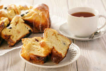 Braided sweet brioche with cheese and dried cranberries.