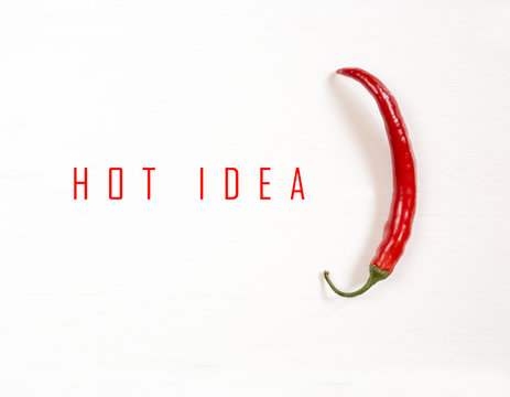 red hot chili pepper on white wooden table