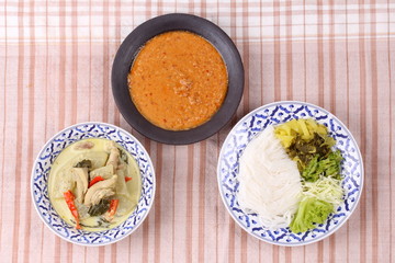 Rice noodle , green chicken curry and fish curry in coconut-milk