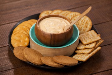 Biscuits with cheese sauce in plate