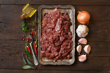 Raw beef liver with spices, herbs  and vegetables
