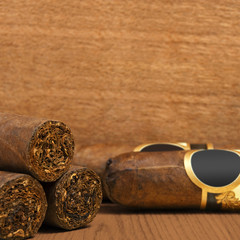 Cuban cigars on wooden background
