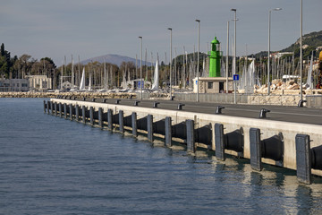 Fototapeta na wymiar Steel bollards and bumpers on new concrete pier in port of Split in Croatia