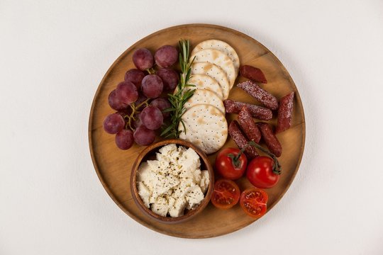 biscuits, cherry tomatoes, grapes, bowl of cheese