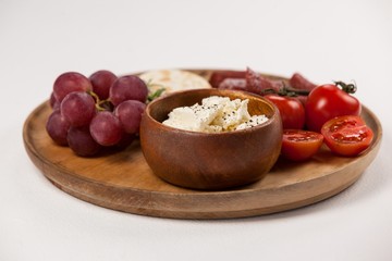biscuits, cherry tomatoes, grapes, bowl of cheese